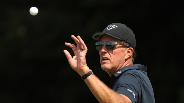 Captain Phil Mickelson of HyFlyers GC catches a ball on the range during Day One of the LIV Golf Invitational - Miami at Trump National Doral Miami on October 20, 2023 in Doral, Florida.